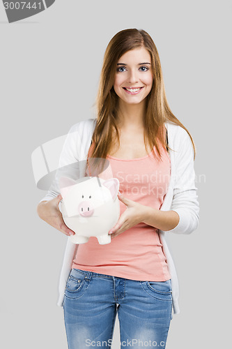 Image of Blonde woman with a piggy bank