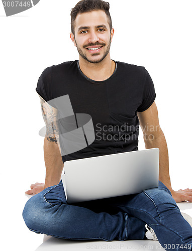 Image of Man working with a laptop