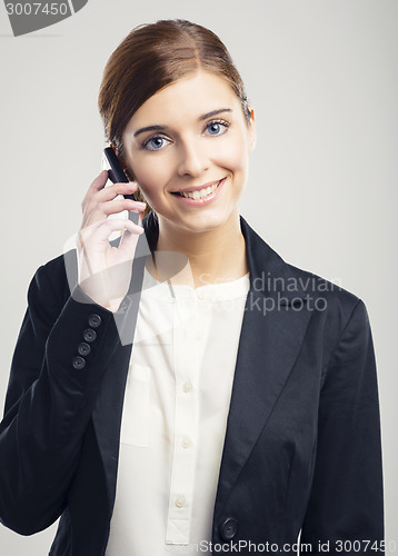 Image of Business woman making phone call
