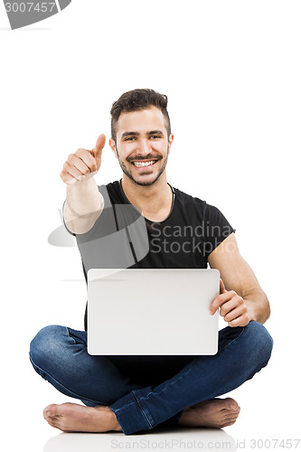 Image of Man working with a laptop