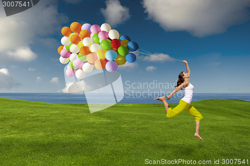 Image of Girl with colorful balloons