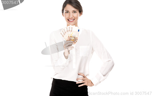 Image of Woman holding euro currency notes