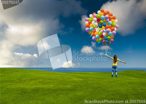 Image of Girl with colorful balloons