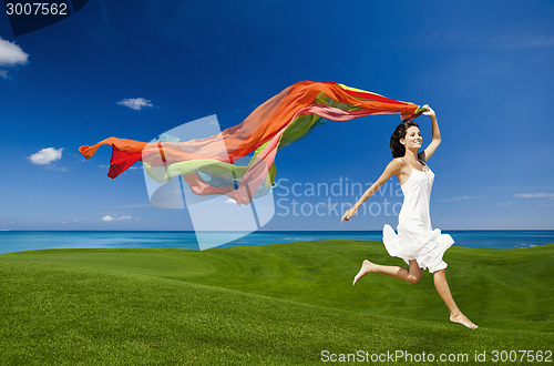 Image of jumping with colored tissues