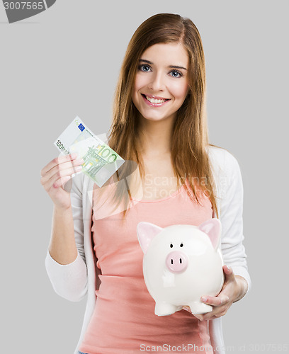 Image of Woman saving money