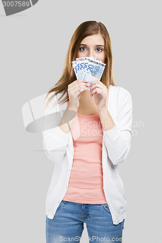 Image of Beautiful woman holding money