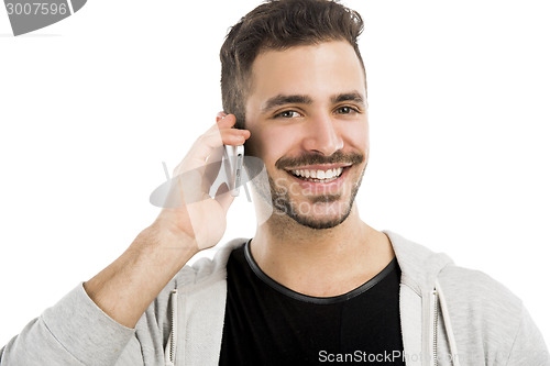 Image of Young man talking on cell phone