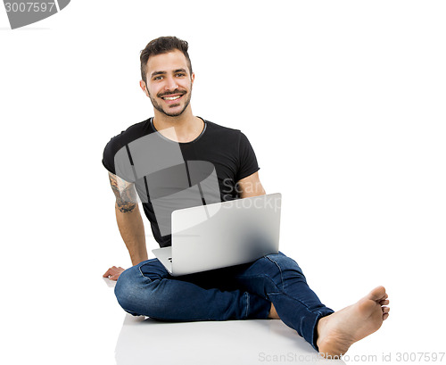 Image of Man working with a laptop