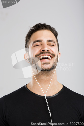 Image of Happy man listen music