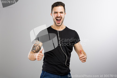 Image of Happy man listen music