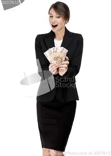 Image of Woman holding euro currency notes