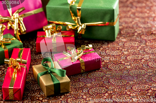 Image of Seven Small Gifts on a Festive Blanket