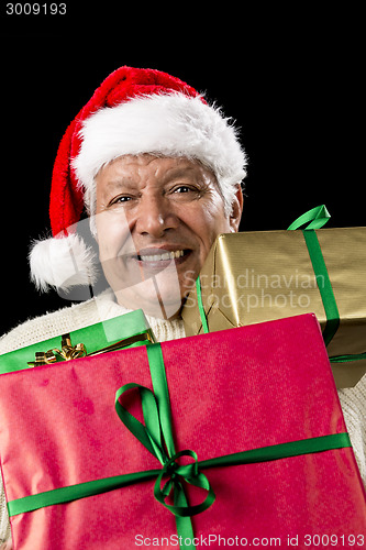 Image of Aged Gentleman Peering Across Three Wrapped Gifts