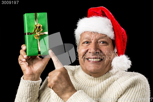 Image of Gleeful Aged Man Pointing At Raised Green Present