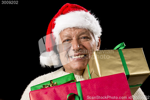 Image of Jolly Old Man With Santa Cap And Three Xmas Gifts