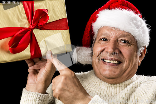 Image of Excited Aged Man Pointing At Golden Gift In Hand