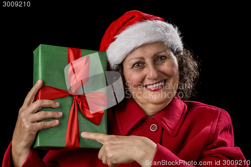 Image of Happy Female Pensioner Pointing at Wrapped Gift
