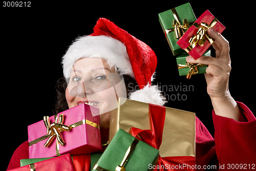 Image of Perky Female Pensioner Presenting Wrapped Gifts
