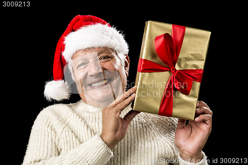 Image of Smiling Old Man With Golden Gift Isolated On Black