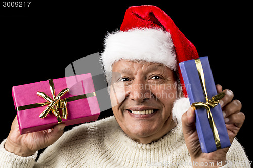 Image of Lighthearted, Smiling Old Man Offering Two Gifts