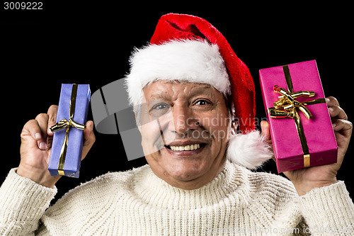 Image of Euphoric Old Man With Two Presents And Santa Hat