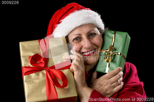 Image of Old Woman in Red with Two Wrapped Christmas Gifts
