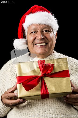 Image of Grey-Haired Man Offering Golden Wrapped Present