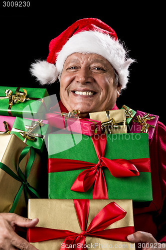 Image of Merry Old Man With Broad Grin Loaded With Gifts