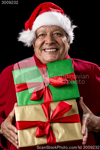 Image of Jolly Male Pensioner In Red With Two Wrapped Gifts