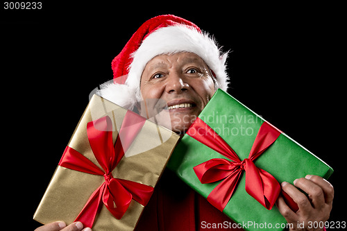 Image of Old Man In Red Gaping Across Two Wrapped Gifts