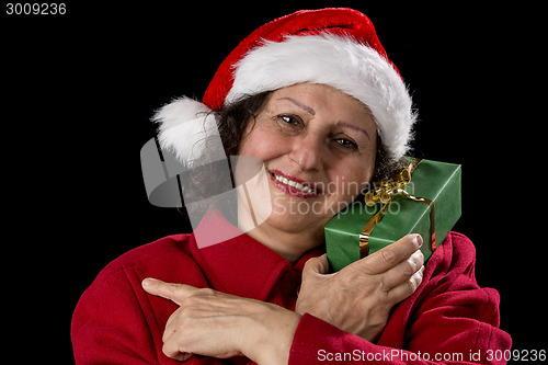 Image of Smiling Female Senior with Red Santa Claus Cap
