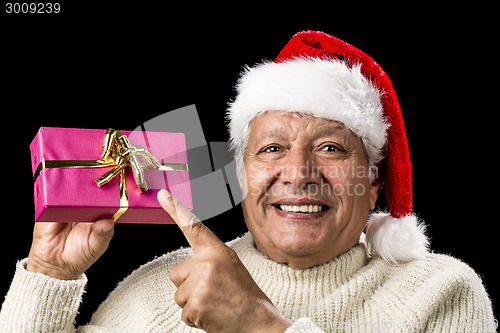 Image of Joyous Old Man Pointing At Magenta Wrapped Gift