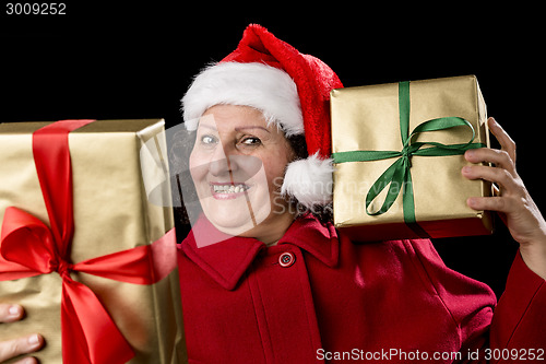 Image of Happy Old Lady in Red with Wrapped Golden Gifts
