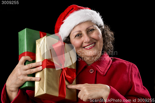 Image of Aged Woman Pointing at Two Gifts, Golden and Green
