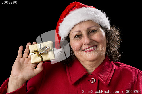 Image of Smiling Old Lady Shows Golden Wrapped Christmas Gift
