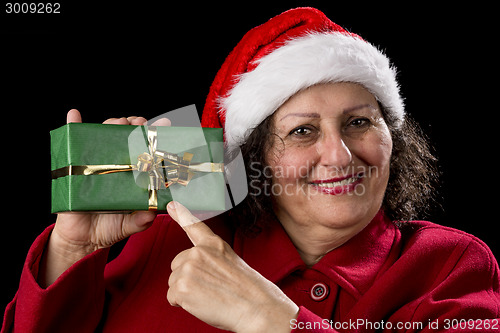 Image of Female Senior Pointing at Green Wrapped Present
