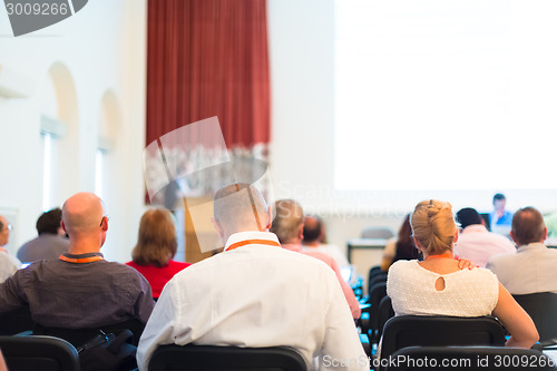 Image of Speaker at Business Conference and Presentation.