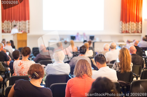 Image of Speaker at Business Conference and Presentation.