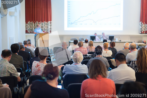 Image of Speaker at Business Conference and Presentation.