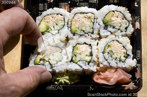 Image of Taking One Tuna Sushi Roll