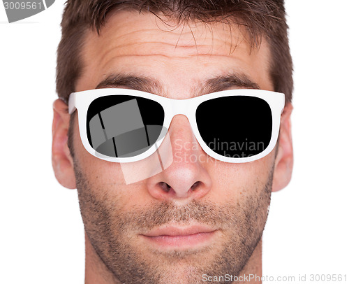 Image of Close-up of a man wearing white sunglasses 