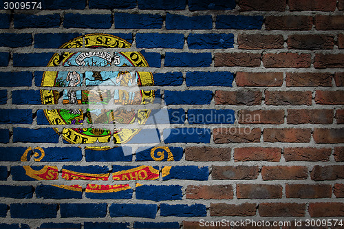 Image of Brick wall texture with flag