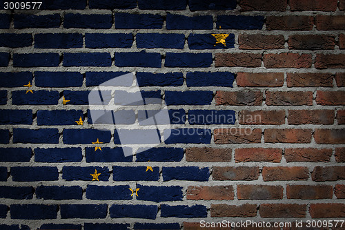 Image of Brick wall texture with flag