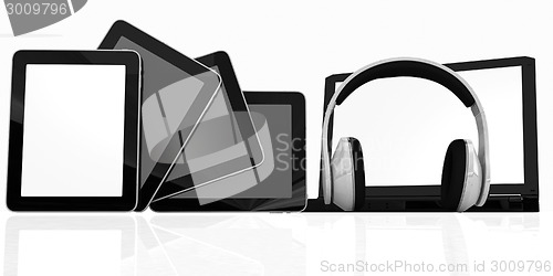 Image of headphones on the  laptop and  tablet pc