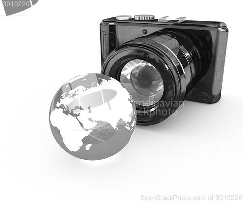 Image of 3d illustration of photographic camera and Earth
