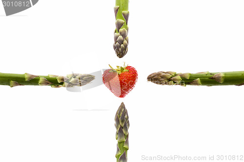 Image of Four Asparagus Spears and One Strawberry