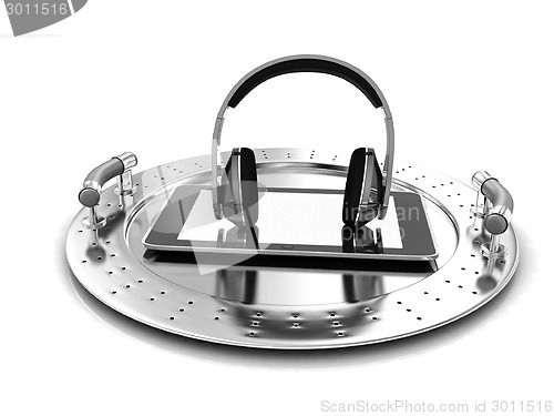 Image of Phone and headphones on metal tray 