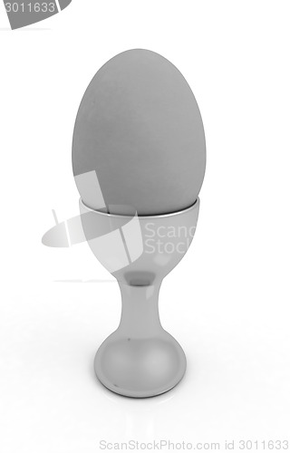 Image of Easter egg on gold egg cups