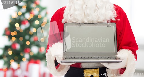 Image of close up of santa claus with laptop