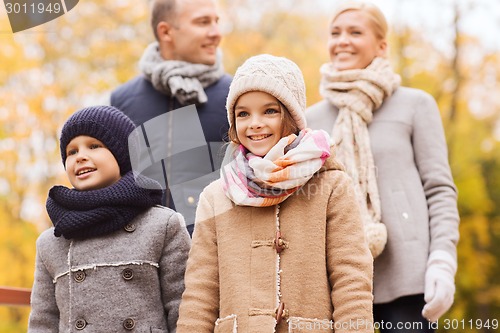 Image of happy family in autumn park